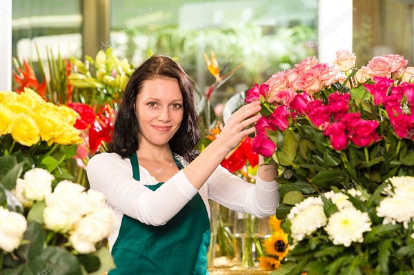 Florists arranging flowers in their shop.